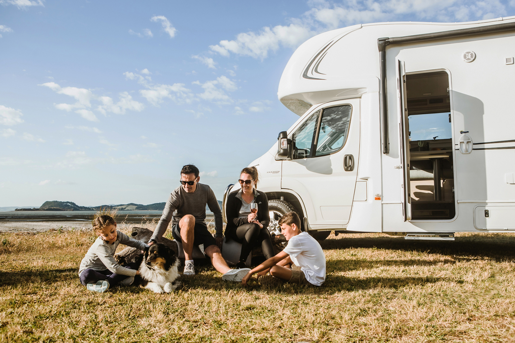 A family enjoying time together beside their motorhome